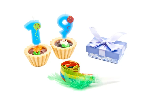 Cakes with nineteen years birthday candles, whistle and gift — Stock Photo, Image