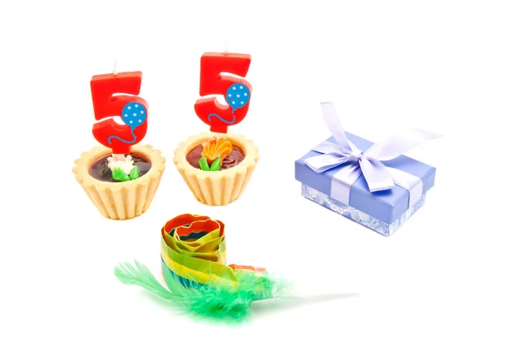 Cakes with fifty five years birthday candles, whistle and gift — Stock Photo, Image