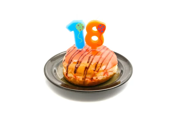 Donut com dezoito anos vela de aniversário — Fotografia de Stock