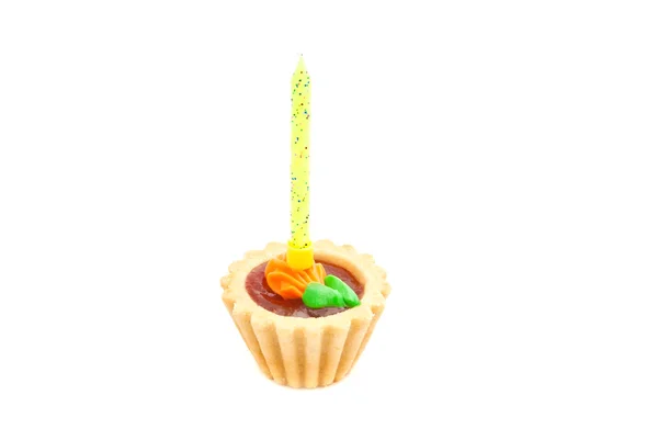 Cake with yellow birthday candle on white — Stock Photo, Image