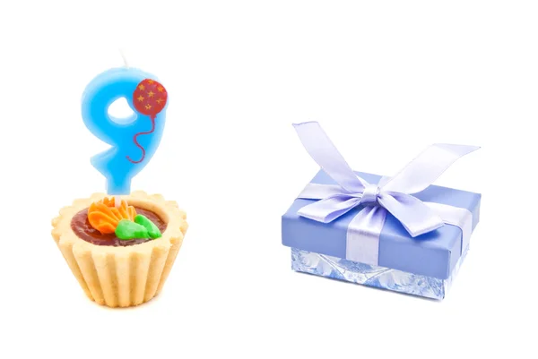 Cake with nine years birthday candle and gift on white — Stock Photo, Image