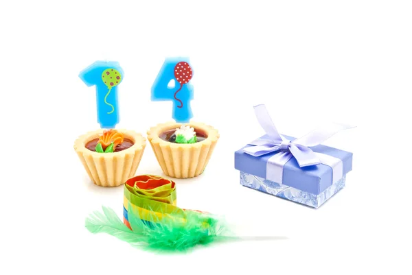 Cakes with fourteen years birthday candles, whistle and gift — Stock Photo, Image