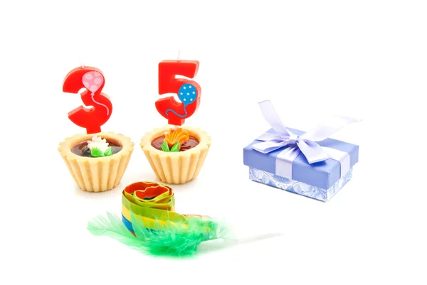 Cakes with thirty five years birthday candles, whistle and gift — Stock Photo, Image