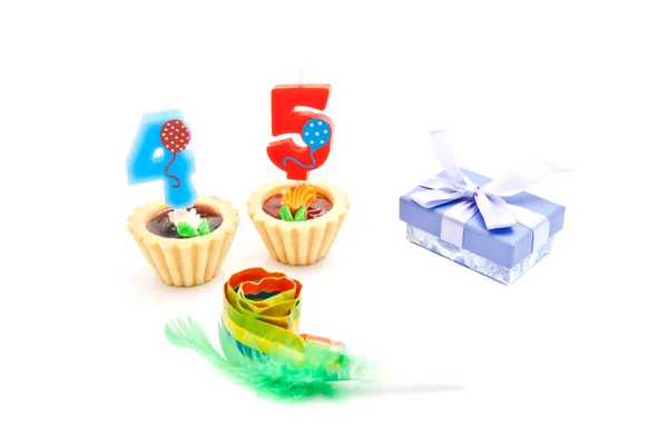 Cakes with forty five years birthday candles, whistle and gift — Stock Photo, Image