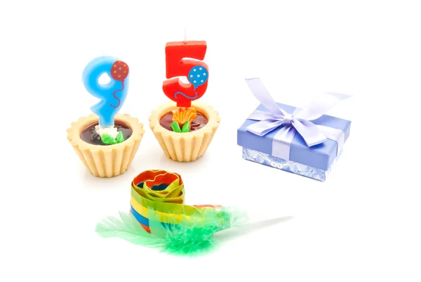 Cakes with ninety five years birthday candles, whistle and gift — Stock Photo, Image
