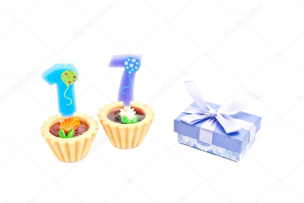 cakes with seventeen years birthday candles and gift 