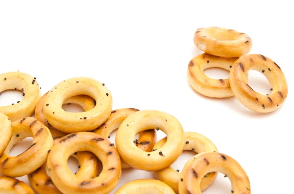 Bunch of tasty bagels on white — Stock Photo, Image