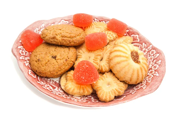クッキーとガラス皿の上の果物のキャンディー — ストック写真