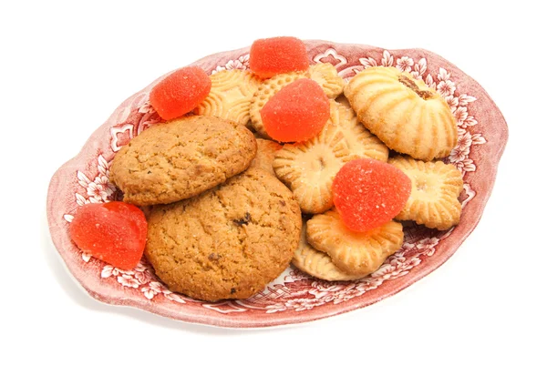 Cookies and fruit candy on a dish — Stock Photo, Image