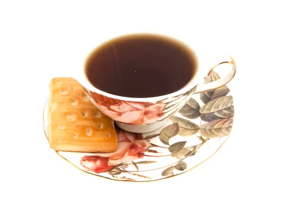 Tasse de thé et délicieux biscuit — Photo