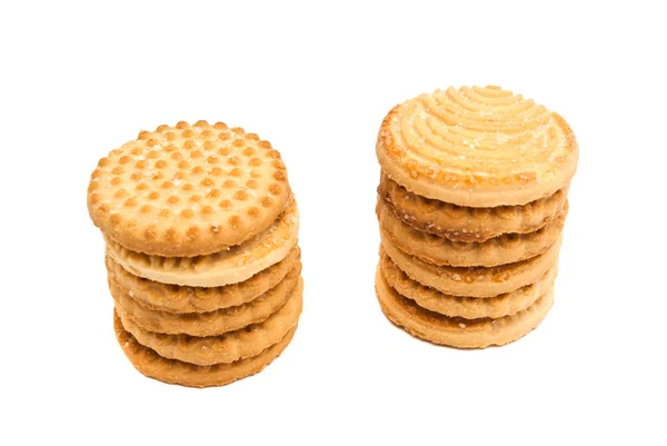 Zwei Stapel leckerer Kekse auf weiß — Stockfoto