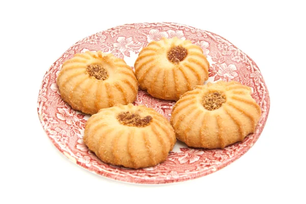 Quatro biscoitos com engarrafamento em um prato — Fotografia de Stock