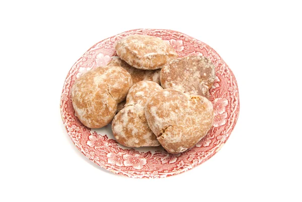 Lebkuchen auf einem Teller auf weiß — Stockfoto