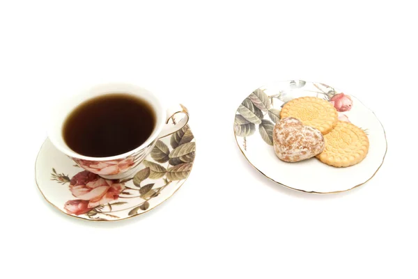 Taza de té y dulces sabrosos — Foto de Stock