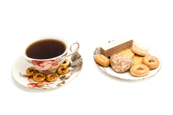 Tazza di tè e dolci gustosi — Foto Stock