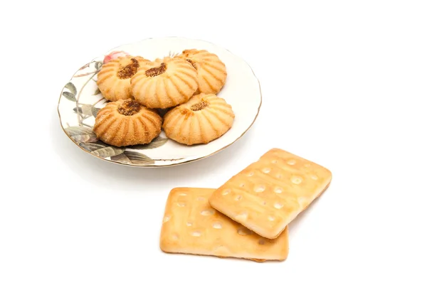 Cookies on glass plate on white — Stock Photo, Image