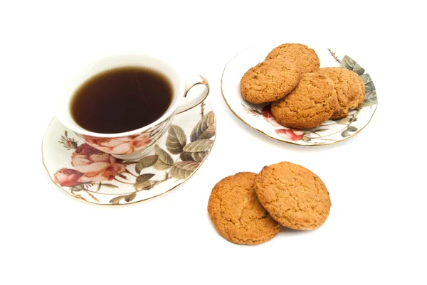 Mug of tea and oatmeal cookies — Stock Photo, Image