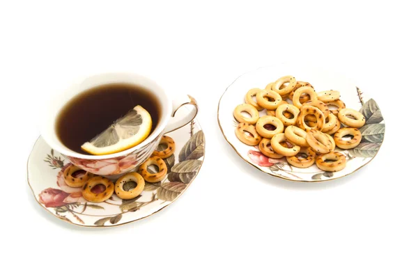 Bagel e tazza di tè con limone — Foto Stock