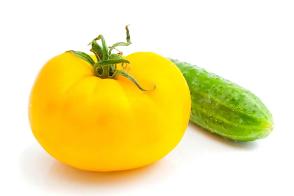 Yellow tomato and cucumber — Stock Photo, Image