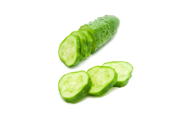 Half a cucumber with slices — Stock Photo, Image