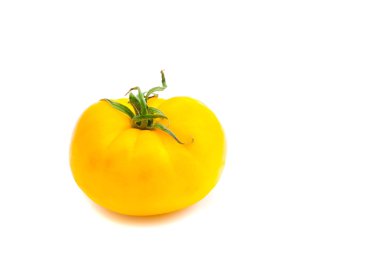 beyaz üzerine tek sarı domates