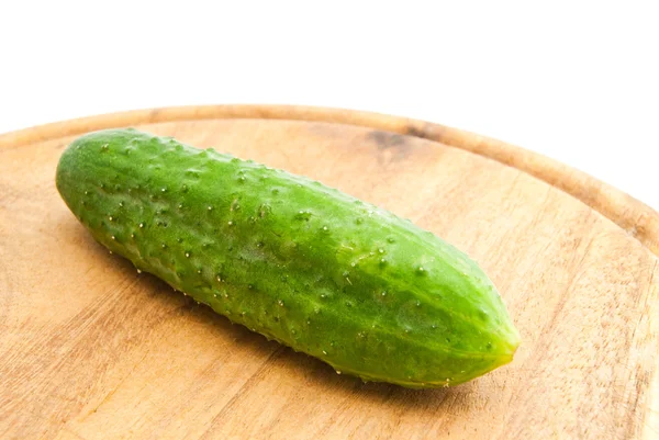 Cucumber on cutting board — Stock Photo, Image