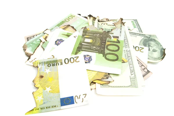 Some burnt bills of dollars and euros on white — Stock Photo, Image