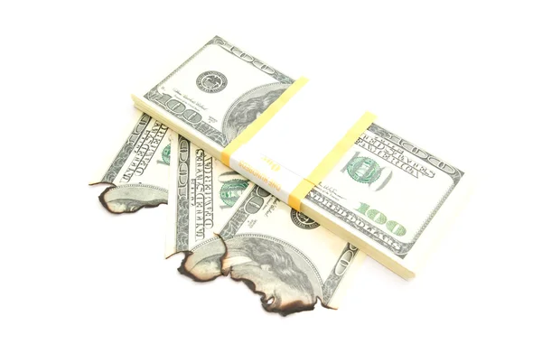 Pacote de dólares e notas queimadas em branco — Fotografia de Stock