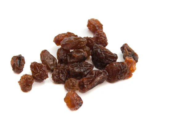 Heap of raisins on white — Stock Photo, Image