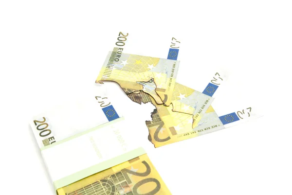 Pack of euros and burned bills on white — Stock Photo, Image