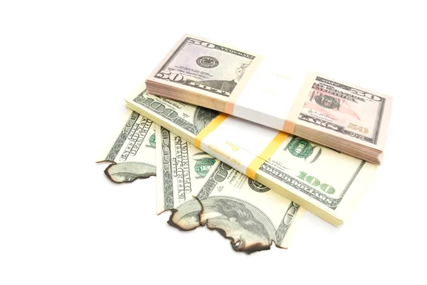 Pack of dollars and burned dollars on white — Stock Photo, Image