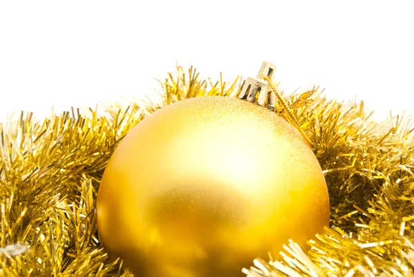 Gold tinsel and christmas tree toy — Stock Photo, Image