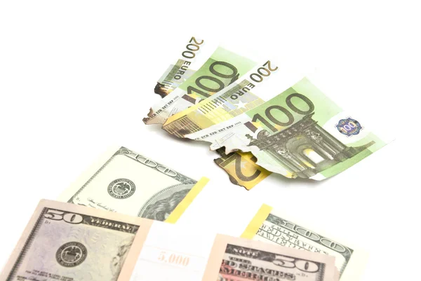 Burned euros and pack of dollars on white — Stock Photo, Image