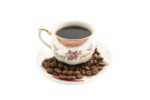 Kaffebønner og kop kaffe - Stock-foto