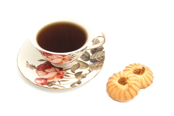 Caneca de chá e dois biscoitos saborosos — Fotografia de Stock