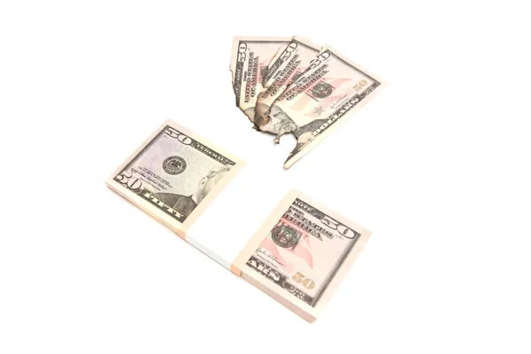 Dollars et factures brûlées sur blanc — Photo