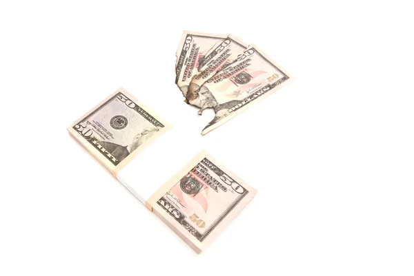 Pack of dollars and burned bills — Stock Photo, Image