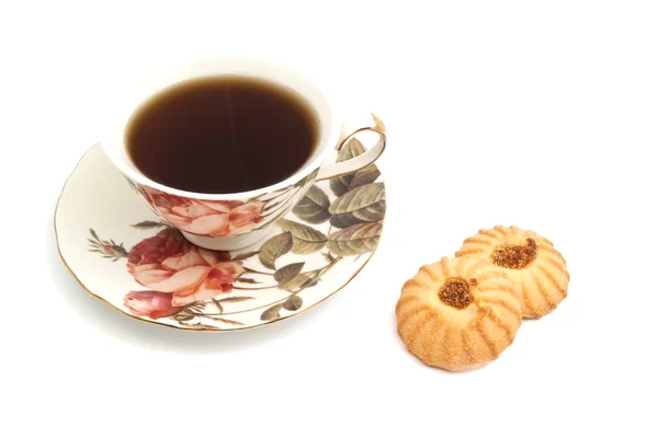 Tazza di tè e due gustosi biscotti Immagine Stock