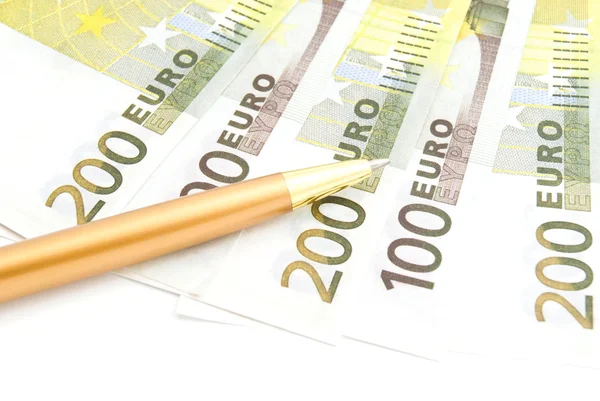 Euros banknotes and pen on white — Stock Photo, Image