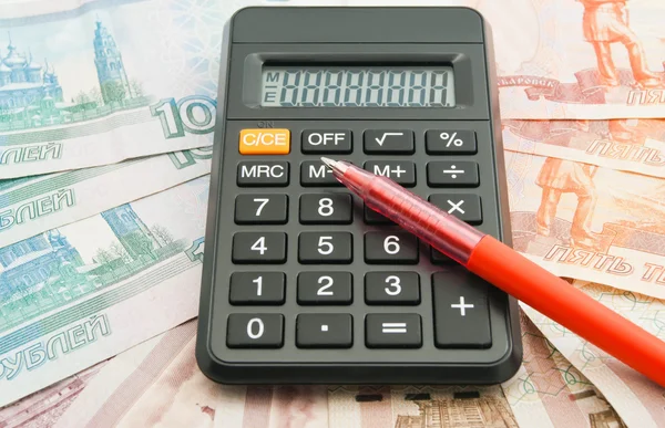 Calculator, Russian banknotes and red pen — Stock Photo, Image