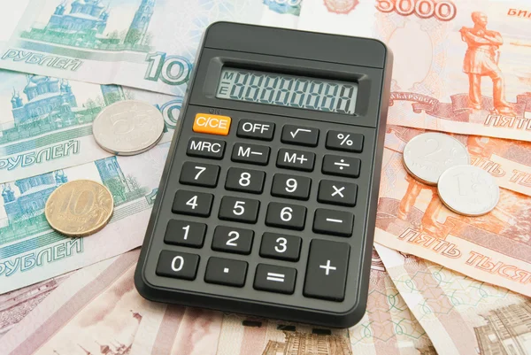 Calculator, Russian banknotes and coins — Stock Photo, Image