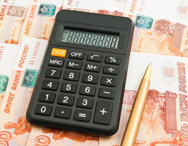 Calculator, ball pen and Russian banknotes — Stock Photo, Image