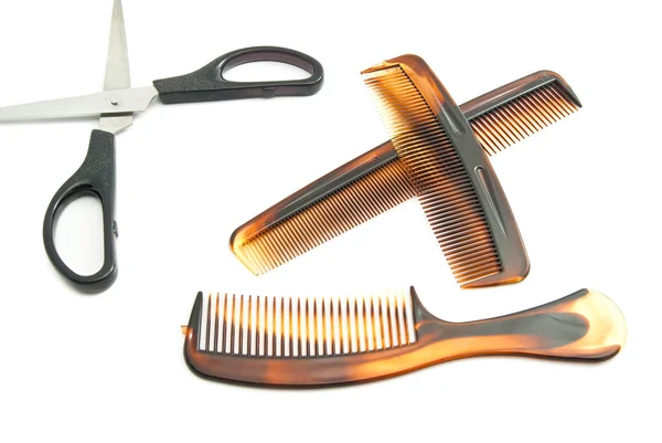 Scissors and combs on white — Stock Photo, Image
