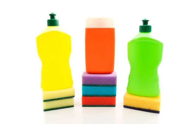 Tres botellas de detergente y esponjas —  Fotos de Stock