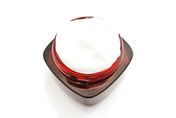 Rood glazen pot van room — Stockfoto