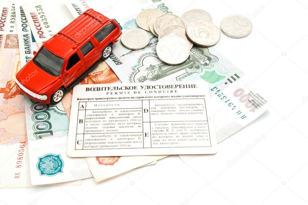 red car, driving license, coins and money