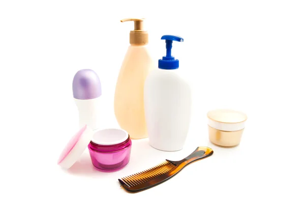 Desodorante, gel, crema y cepillo para el cabello en blanco —  Fotos de Stock