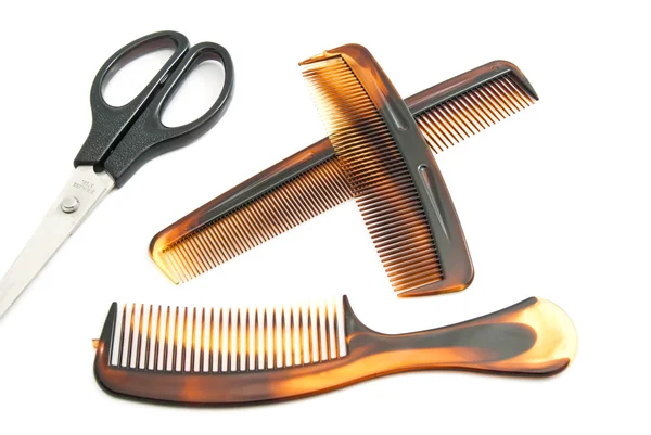 Scissors and plastic combs on white — Stock Photo, Image