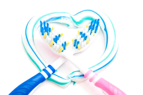 Toothbrushes in the heart — Stock Photo, Image