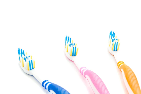 Tres cepillos de dientes coloridos — Foto de Stock